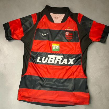 Blessed Jerseys Flamengo football jersey with red and black horizontal stripes, classic collar, and short sleeves. Features club crest and sponsor logos.