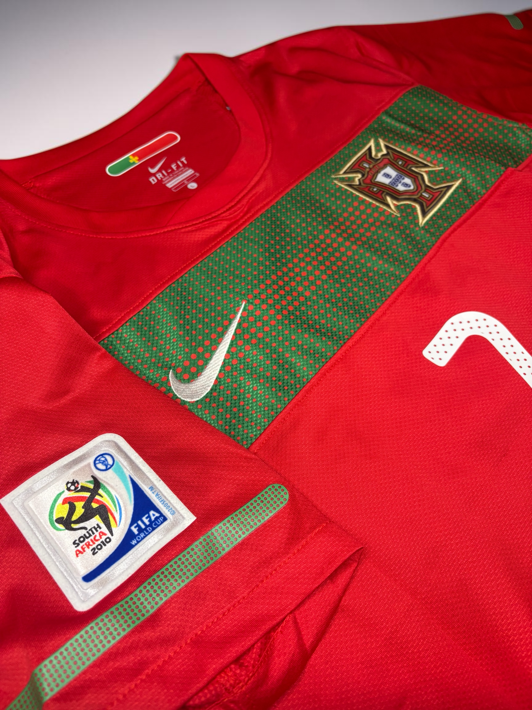 Blessed Jerseys Portugal National Team Soccer Jersey, red polyester Dri-FIT with green band, crest, and 2010 World Cup patch.